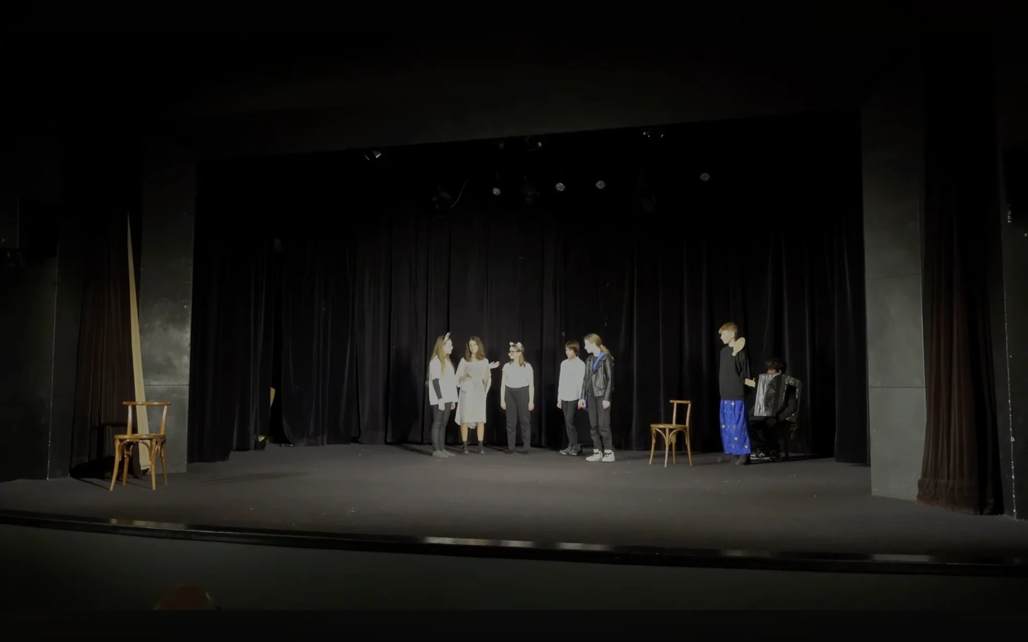 Students performing The Hitchhiker’s Guide to the Galaxy on stage at Jaroslav Seifert Grammar School