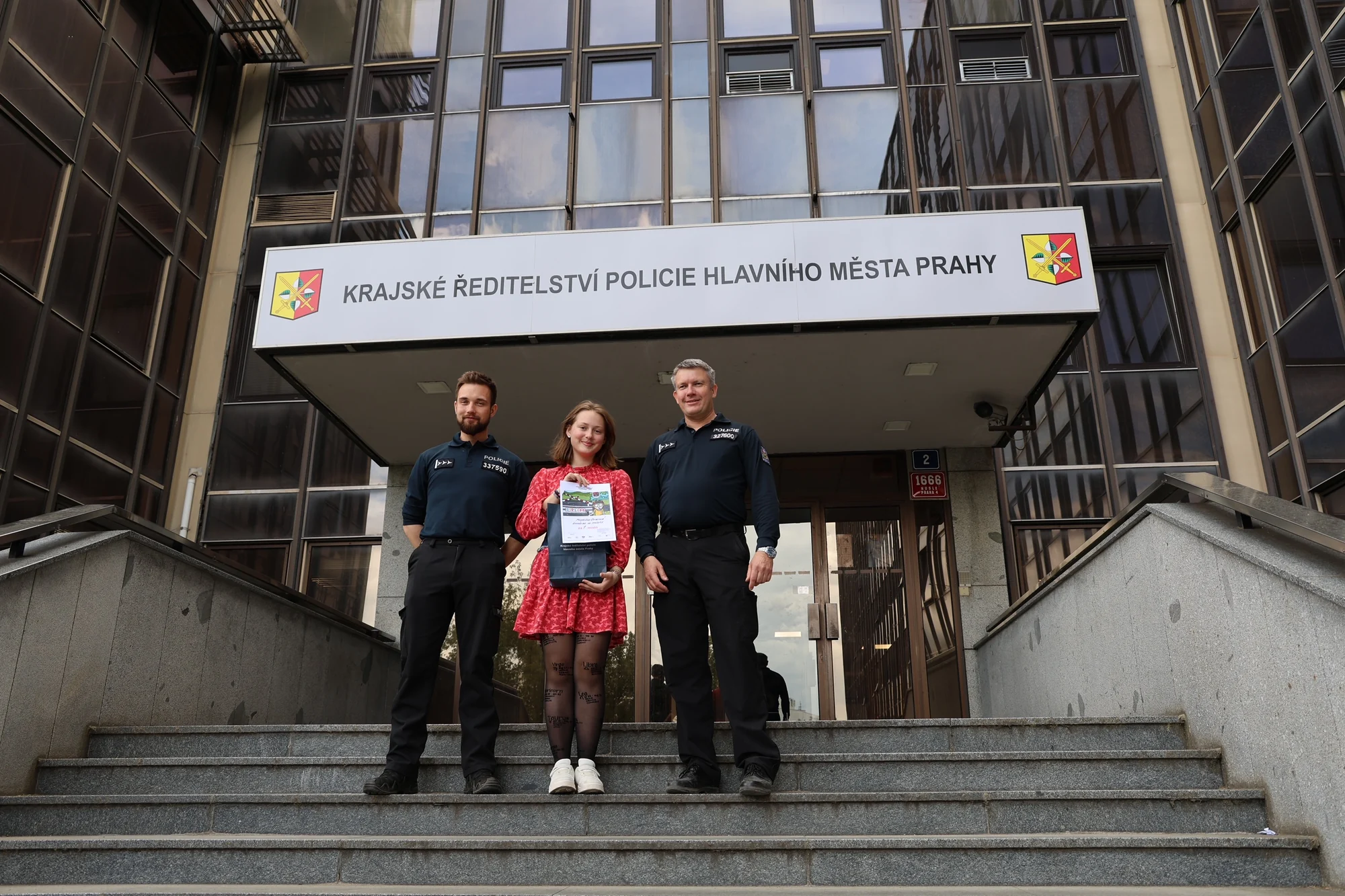 Magdaléna receiving her road-safety competition award at the Prague Police Headquarters